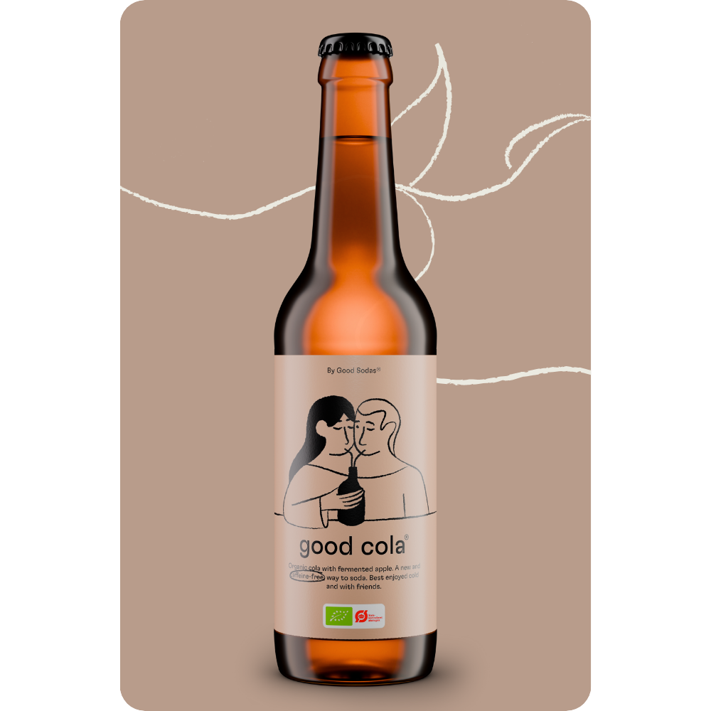 A bottle of good cola, which is a fermented, organic and reduced sugar soda with no caffeine, presented on a brown background.