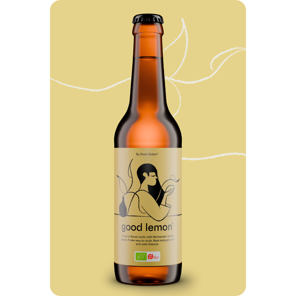 A bottle of good lemon, which is an organic, fermented and reduced sugar soda on a yellow background.